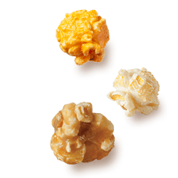 A picture of three kernels flavored Cheddar Cheese, Kettle Corn and Caramel Corn.