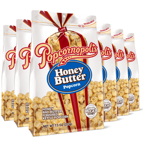 A picture of six pouches Net 7.5 of gourmet Popcornopolis® popcorn flavored Honey Butter gourmet popcorn.