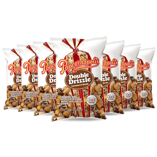 Bags of Popcornopolis® flavored Double Drizzle gourmet popcorn.