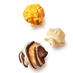 A picture of three kernels flavored Caramel Corn, Zebra® Popcorn and Kettle Corn.