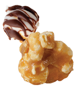 Picture of a 2-gourmet kernels flavored Caramel and Zebra® Popcorn topped with white chocolate and dark chocolate.