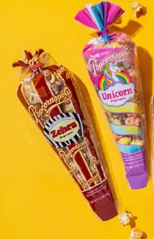 Picture of two gourmet mini cones flavored of Zebra® and Unicorn. With yellow background.
